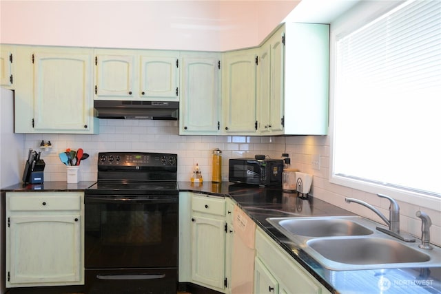 202 E 3rd Ave, Ritzville, WA 99169 - kitchen with black appliances, under cabinet range hood, plenty of natural light, and tasteful backsplash
