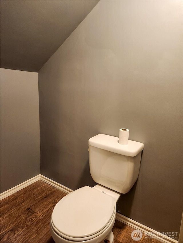 202 E 3rd Ave, Ritzville, WA 99169 - bathroom featuring wood finished floors and vaulted ceiling