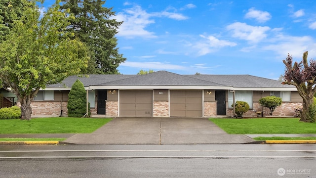 501 21st St SE, Auburn, WA 98002 - view of front of property with an attached garage, brick siding, concrete driveway, and a front lawn