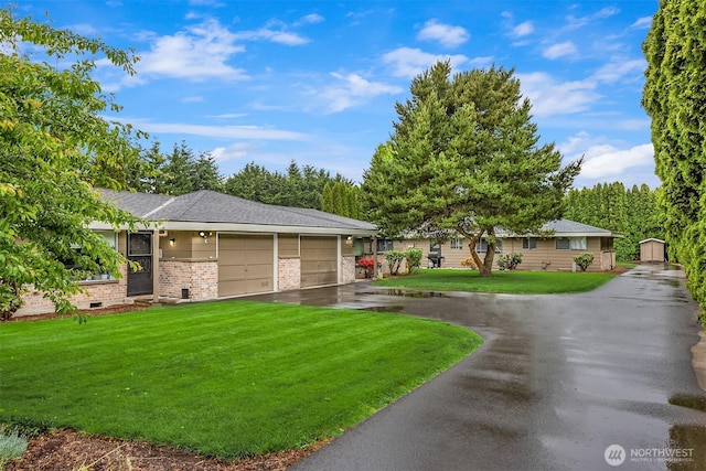 501 21st St SE, Auburn, WA 98002 - view of home's community featuring a lawn, asphalt driveway, and a garage