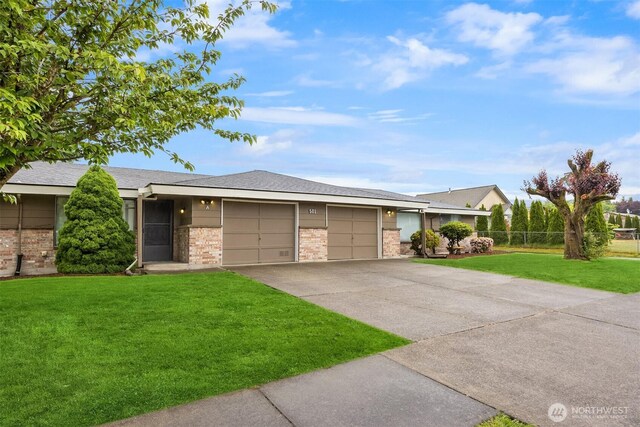 501 21st St SE, Auburn, WA 98002 - view of front facade featuring brick siding, a garage, and driveway