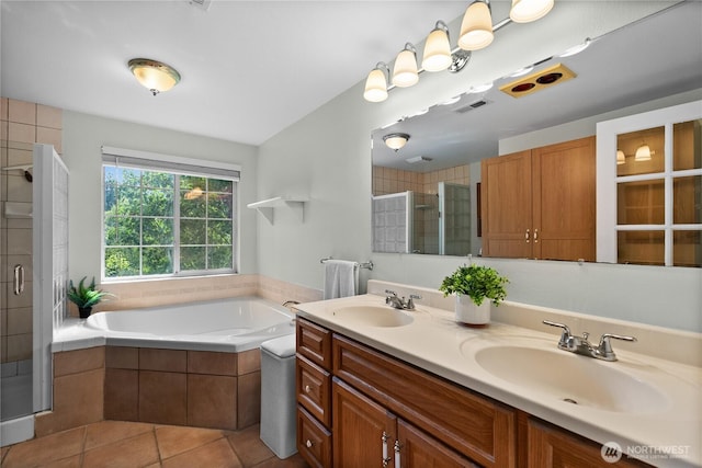 11810 County Line Rd E, Edgewood, WA 98372 - full bathroom featuring a shower stall, a bath, double vanity, and tile patterned flooring