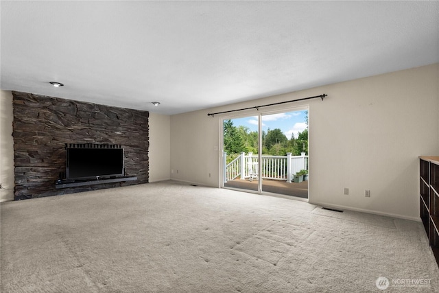 11810 County Line Rd E, Edgewood, WA 98372 - unfurnished living room with a stone fireplace and carpet floors