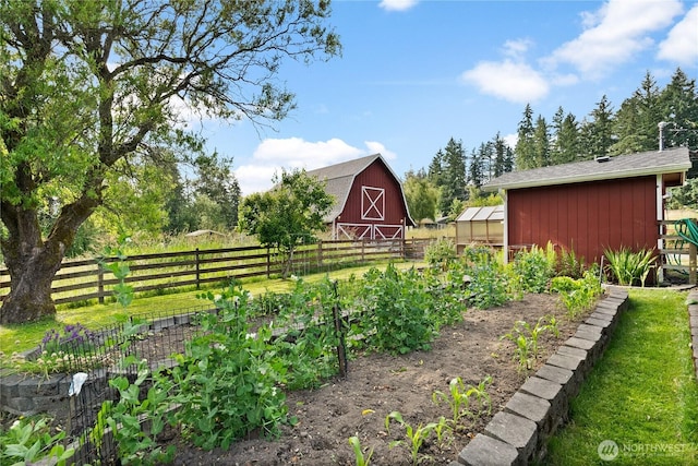 11810 County Line Rd E, Edgewood, WA 98372 - view of yard with a vegetable garden, an outbuilding, a barn, and an exterior structure