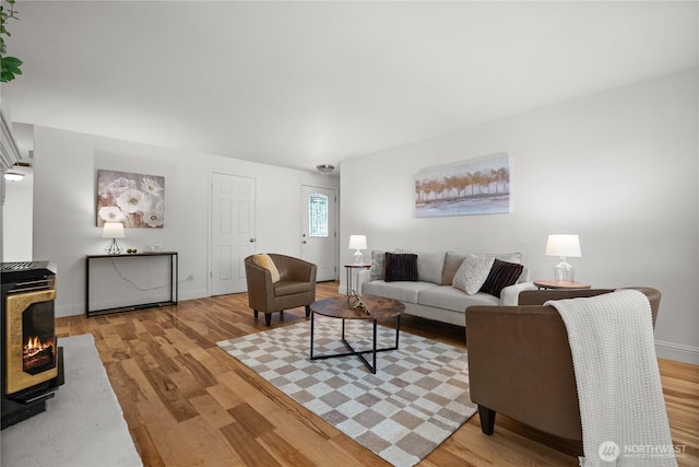 11810 County Line Rd E, Edgewood, WA 98372 - living area featuring light wood-style floors and a wood stove