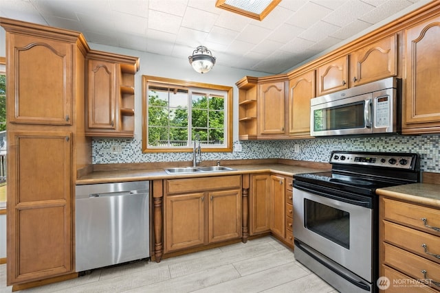 262 Falls Rd, Randle, WA 98377 - kitchen featuring appliances with stainless steel finishes, open shelves, decorative backsplash, and brown cabinetry
