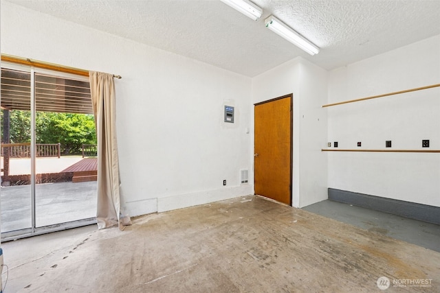 262 Falls Rd, Randle, WA 98377 - unfurnished room featuring concrete floors and a textured ceiling