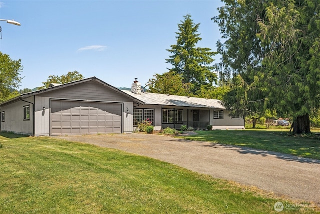 262 Falls Rd, Randle, WA 98377 - single story home featuring a garage, a front yard, driveway, and a chimney