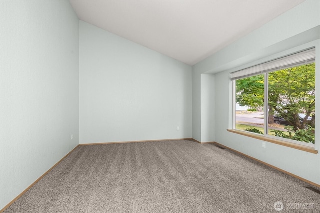 5411 Komachin Loop SE, Lacey, WA 98513 - spare room featuring carpet and lofted ceiling