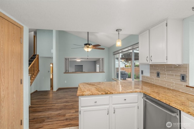 5411 Komachin Loop SE, Lacey, WA 98513 - kitchen with dishwasher, a peninsula, dark wood-style floors, white cabinetry, and backsplash