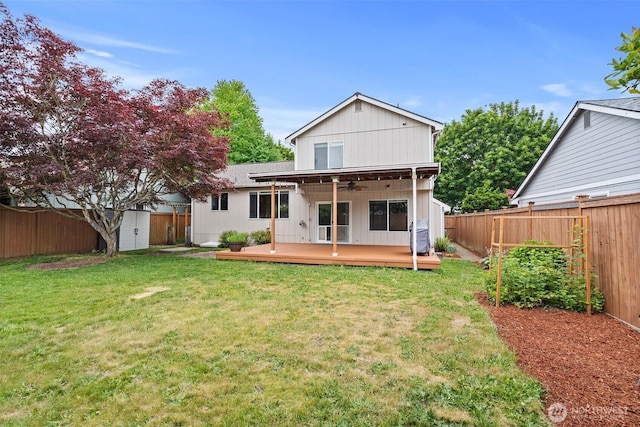 5411 Komachin Loop SE, Lacey, WA 98513 - back of house featuring a storage shed, ceiling fan, a fenced backyard, and a wooden deck