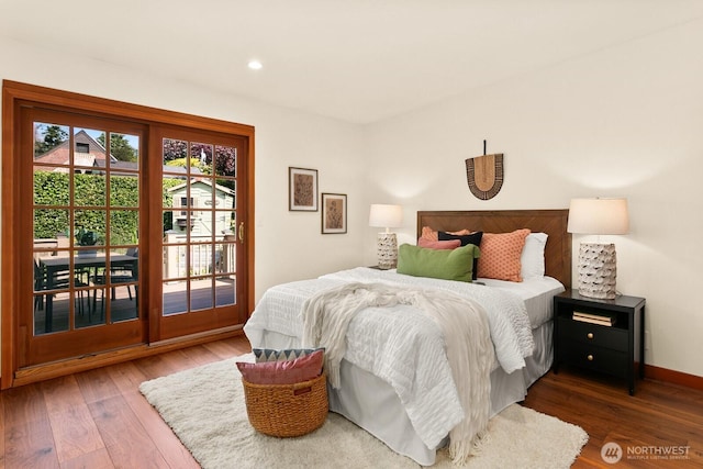 12238 9th Ave NW, Seattle, WA 98177 - bedroom with access to exterior, wood finished floors, and recessed lighting