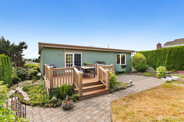 12238 9th Ave NW, Seattle, WA 98177 - rear view of house featuring a wooden deck and outdoor dining area