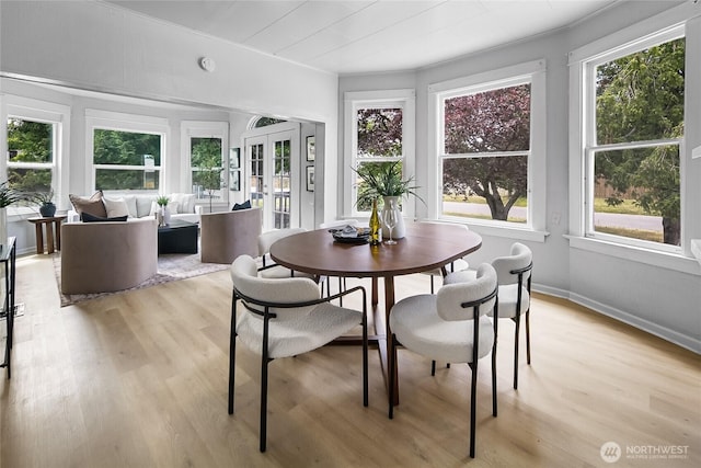 1103 E 59th St, Tacoma, WA 98404 - dining space featuring light wood-type flooring, french doors, and ornamental molding