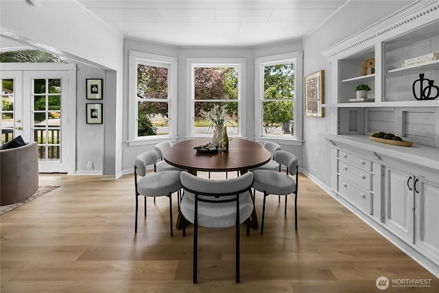 1103 E 59th St, Tacoma, WA 98404 - dining space featuring healthy amount of natural light and light wood-style flooring