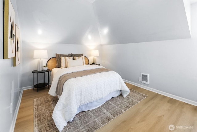 1103 E 59th St, Tacoma, WA 98404 - bedroom featuring wood finished floors and vaulted ceiling