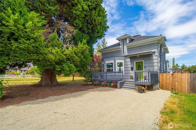 1103 E 59th St, Tacoma, WA 98404 - view of front of house with a wooden deck and driveway