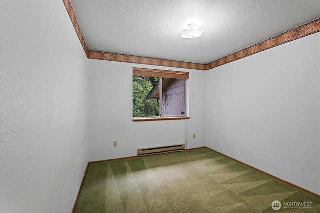 7634 Shilohwood Pl NW, Bremerton, WA 98311 - empty room with a baseboard heating unit, carpet, and a textured ceiling