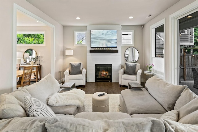 10702 39th Ave NE, Seattle, WA 98125 - living room featuring a large fireplace, plenty of natural light, recessed lighting, and dark wood finished floors