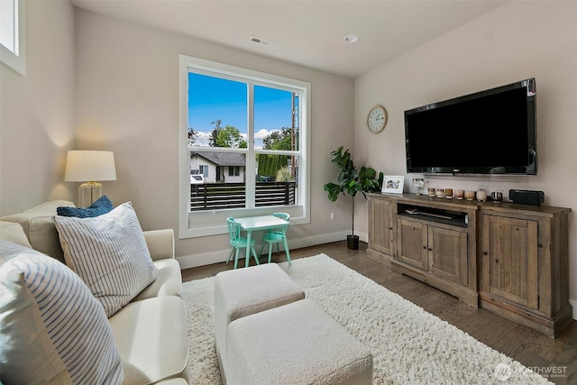 10702 39th Ave NE, Seattle, WA 98125 - living area featuring baseboards and dark wood-style floors