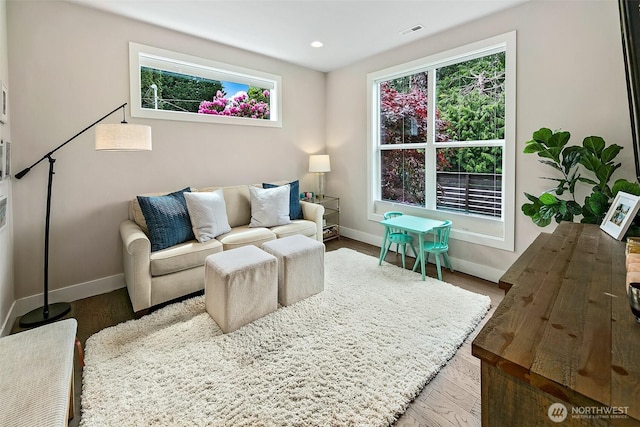 10702 39th Ave NE, Seattle, WA 98125 - living room with plenty of natural light, wood finished floors, and recessed lighting