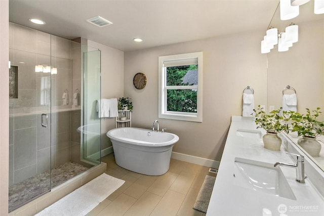 10702 39th Ave NE, Seattle, WA 98125 - full bath with a shower stall, double vanity, a freestanding bath, and recessed lighting