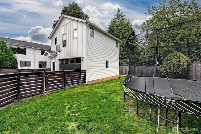 10702 39th Ave NE, Seattle, WA 98125 - fenced backyard with a trampoline and a garage