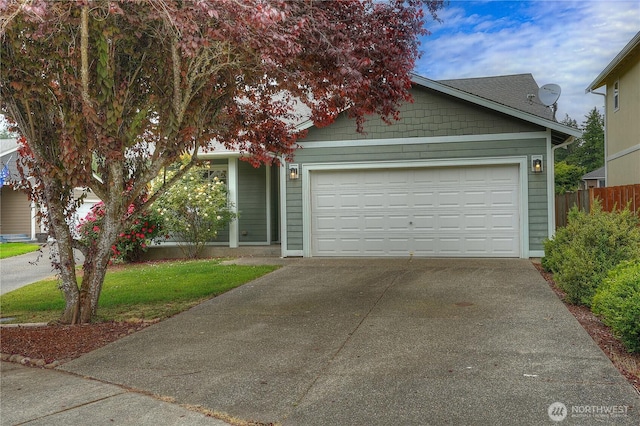 20614 6th Avenue Ct E, Spanaway, WA 98387 - view of front of home with concrete driveway and an attached garage