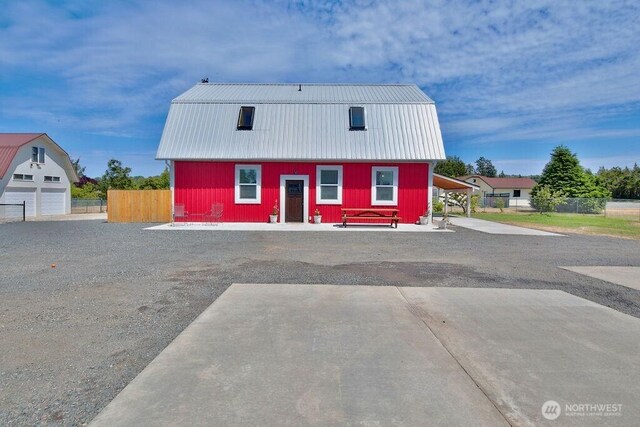 132 Milky Way, Sequim, WA 98382 - view of front facade featuring a metal roof and a gambrel roof