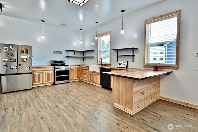 132 Milky Way, Sequim, WA 98382 - kitchen with stainless steel appliances, open shelves, light wood finished floors, light brown cabinetry, and butcher block countertops