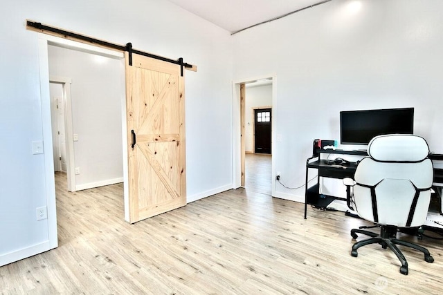132 Milky Way, Sequim, WA 98382 - office featuring a barn door and wood finished floors