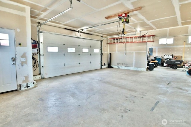 132 Milky Way, Sequim, WA 98382 - garage featuring a garage door opener