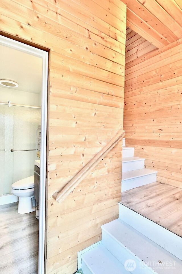 132 Milky Way, Sequim, WA 98382 - stairs featuring a sauna / steam room, wooden walls, and wood finished floors