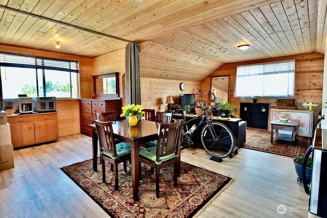 132 Milky Way, Sequim, WA 98382 - dining area with wooden walls, healthy amount of natural light, wood ceiling, wood finished floors, and vaulted ceiling