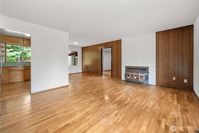 3824 S 176th St, Seatac, WA 98188 - unfurnished living room featuring wood walls and light wood-style floors
