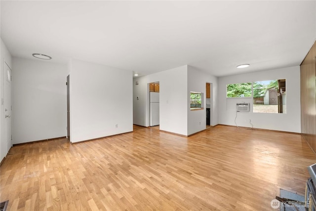 3824 S 176th St, Seatac, WA 98188 - unfurnished living room with light wood finished floors and a wall mounted AC