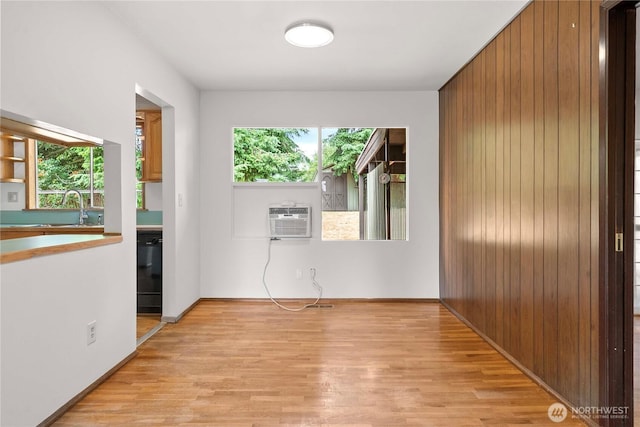 3824 S 176th St, Seatac, WA 98188 - empty room with a wall mounted AC, light wood-type flooring, and wooden walls