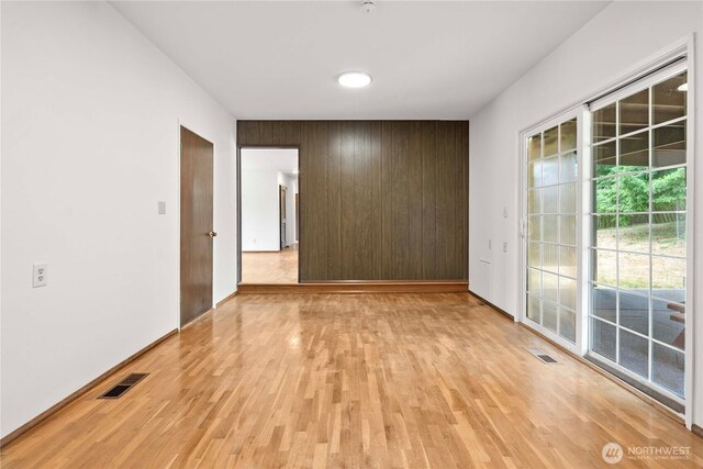 3824 S 176th St, Seatac, WA 98188 - unfurnished room with light wood-style floors and wood walls