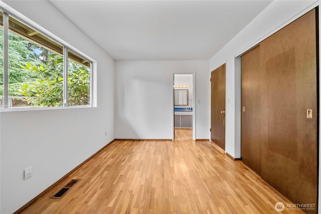 3824 S 176th St, Seatac, WA 98188 - unfurnished bedroom with light wood-style floors, ensuite bath, and a closet