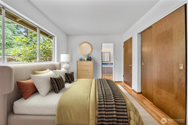 3824 S 176th St, Seatac, WA 98188 - bedroom with wood finished floors and connected bathroom