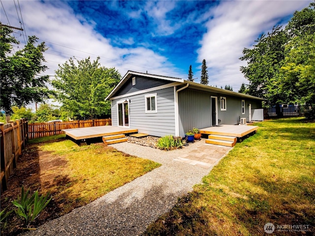 1804 SE 10th Ave, Olympia, WA 98501 - back of property with a wooden deck and a fenced backyard