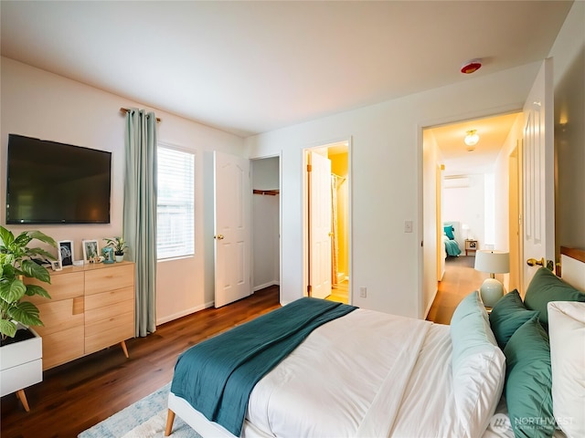 1804 SE 10th Ave, Olympia, WA 98501 - bedroom featuring wood finished floors, ensuite bath, and a wall mounted air conditioner