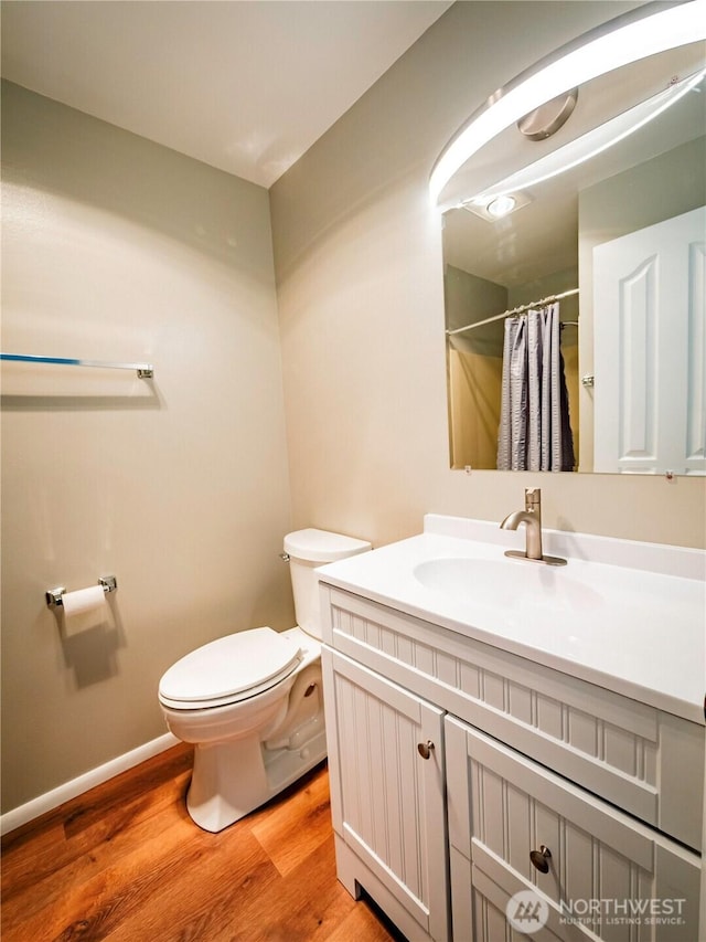 1804 SE 10th Ave, Olympia, WA 98501 - full bathroom featuring wood finished floors, vanity, and a shower with curtain