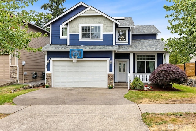 815 6th Ave SW, Olympia, WA 98512 - craftsman house with stone siding, a porch, concrete driveway, an attached garage, and roof mounted solar panels
