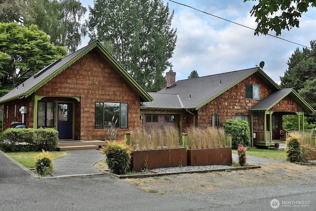 121 4th St, Langley, WA 98260 - view of front facade with a chimney and a shingled roof