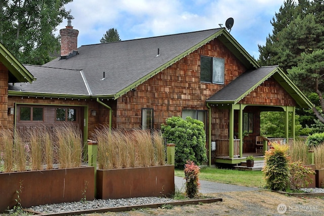 121 4th St, Langley, WA 98260 - back of property featuring roof with shingles and a chimney