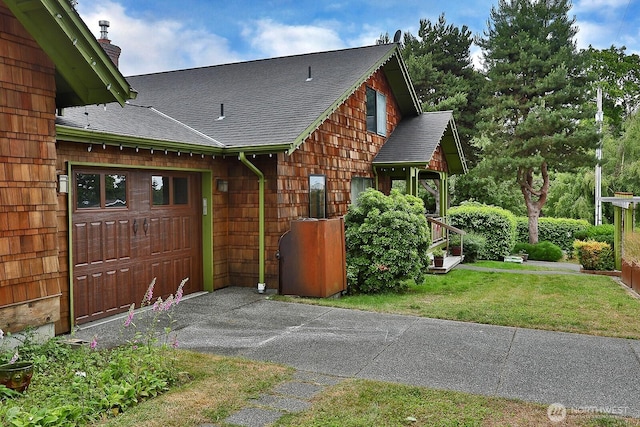 121 4th St, Langley, WA 98260 - view of side of property with roof with shingles, a chimney, and a lawn