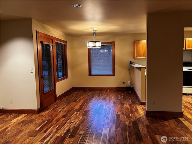 121 4th St, Langley, WA 98260 - unfurnished dining area with wood finished floors and baseboards