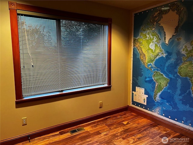 121 4th St, Langley, WA 98260 - spare room with wood finished floors and baseboards