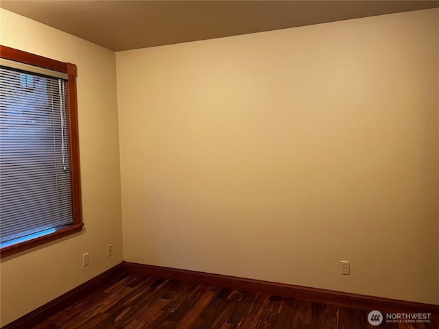 121 4th St, Langley, WA 98260 - unfurnished room with baseboards and dark wood-style flooring